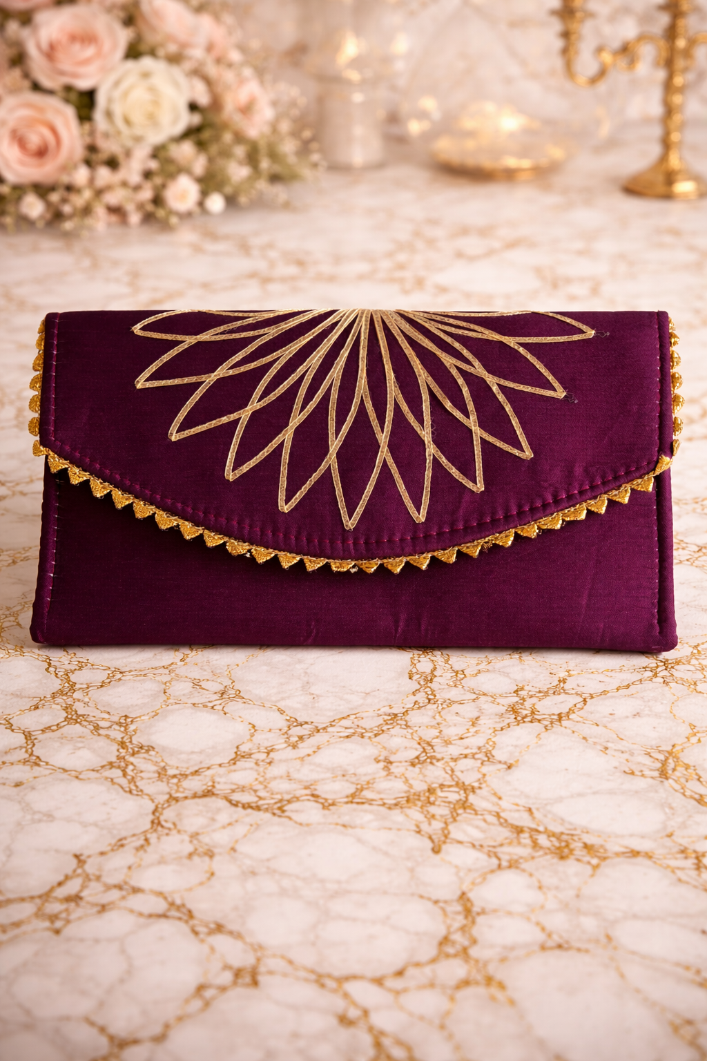 Purple clutch with gold embroidery