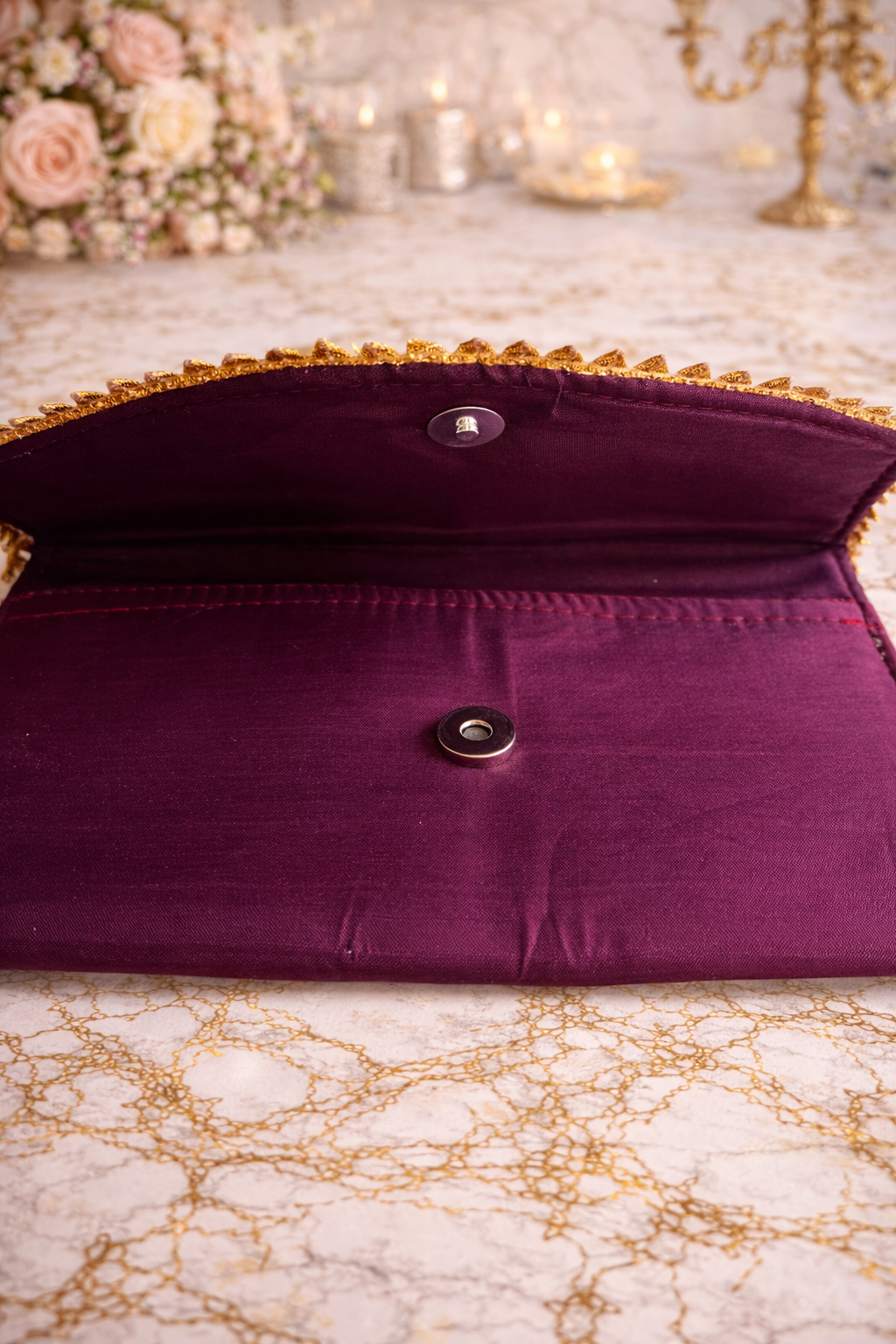 Wine clutch bag with gold trim 