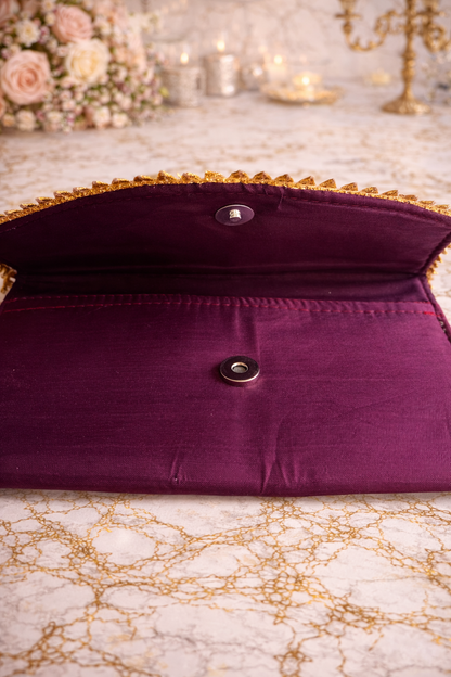 Wine clutch bag with gold trim 